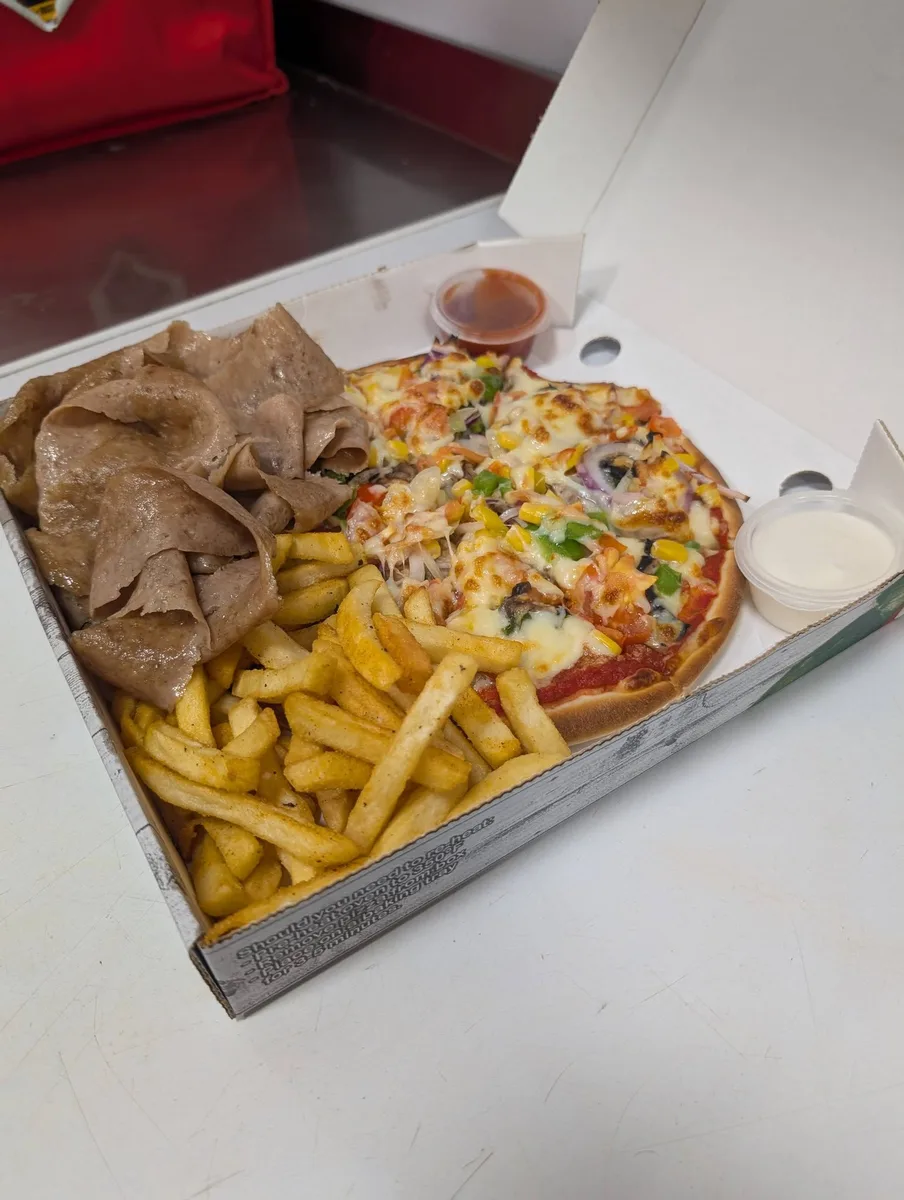 Share box with pizza, fries and doner meat wrap